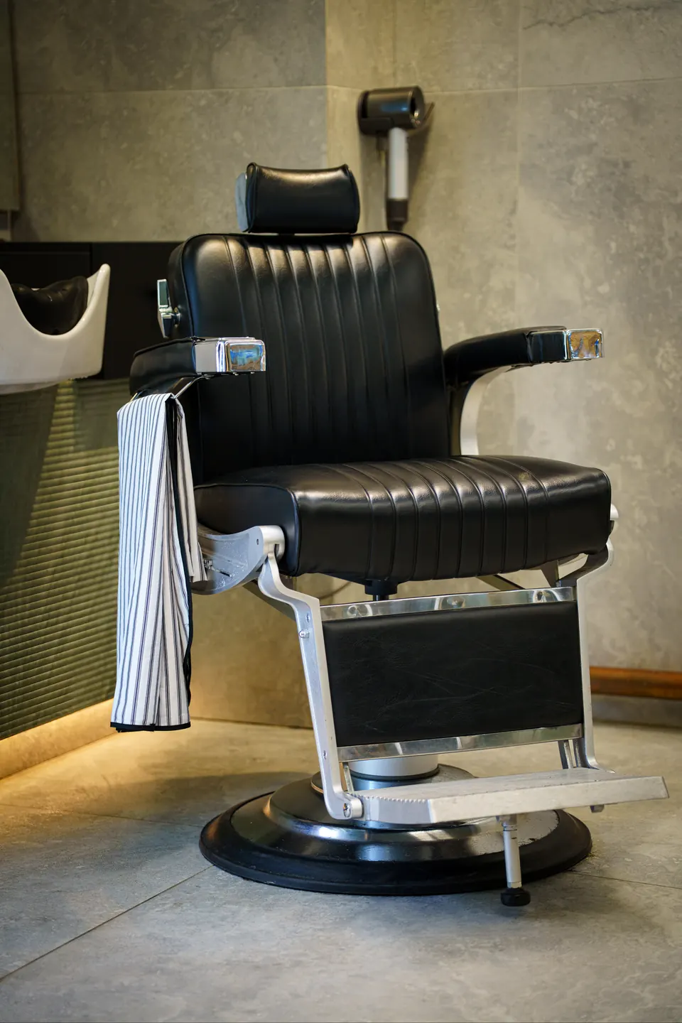 A black leather barber chair