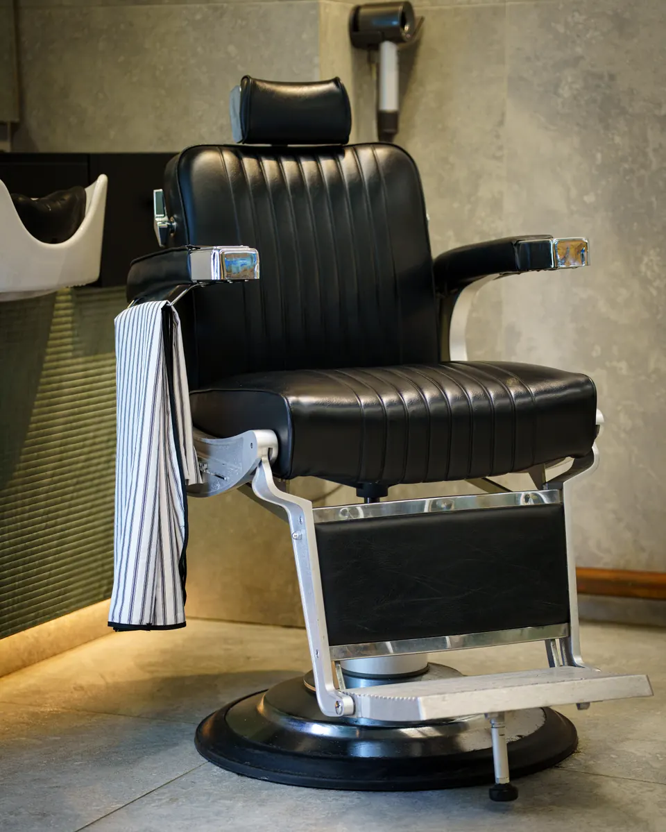 A black leather barber chair